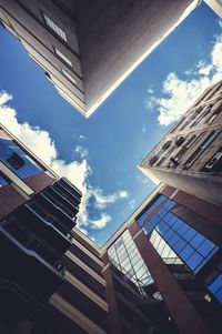 Low angle view of office building against sky