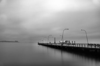 Pier over sea against sky