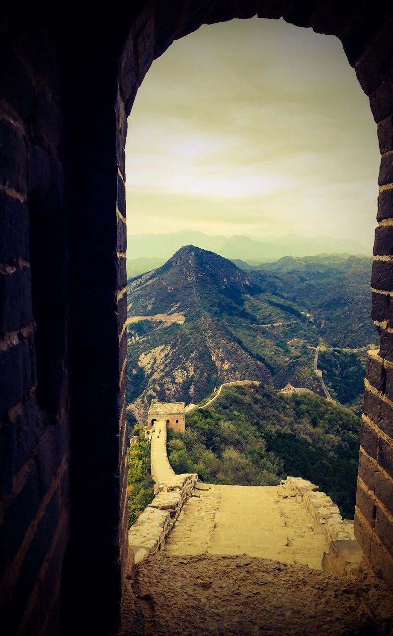 landscape, beauty in nature, scenics, arch, nature, tranquility, no people, tranquil scene, sky, mountain, built structure, day, architecture, indoors