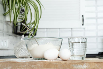 Close-up of eggs in glass container on table