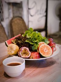 Close-up of salad with dip on table