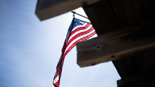 Low angle view of flag against sky