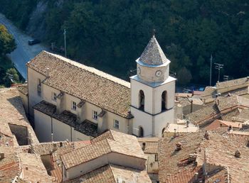 High angle view of buildings in town during sunny day