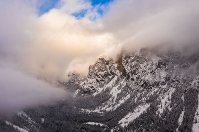 Aerial of mountains in styria, green lake gruner see cloudy winter day tourist destination