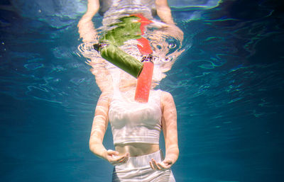 Full length of woman swimming in sea