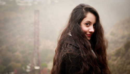 Portrait of young woman looking away