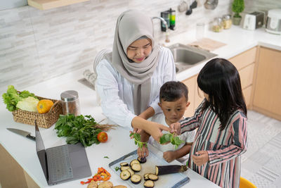 High angle view of people on cutting board