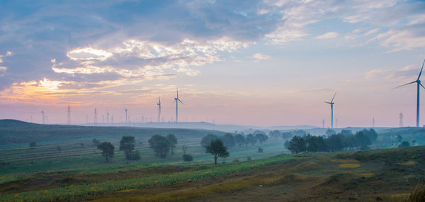 Scenic view of landscape against sky during sunset