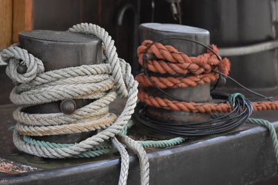 Close-up of rope tied up on rusty metal