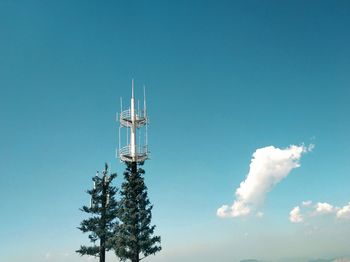 Low angle view of communications tower against sky