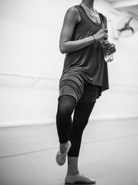 Low section of woman standing on floor