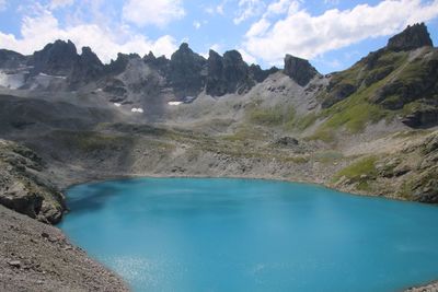 Scenic view of lake and mountains against sky