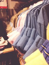 Close-up of clothes hanging on rack in store