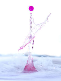 Close-up of water over white background