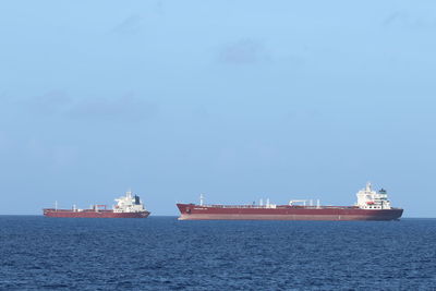 Ships sailing on sea against sky