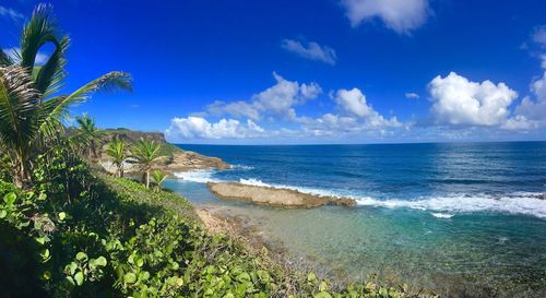 Scenic view of sea against blue sky