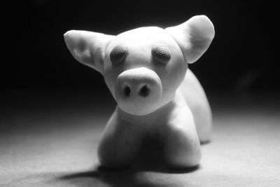 Close-up of stuffed toy against black background