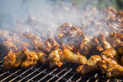 Close-up of meat on barbecue grill