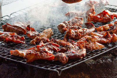 Close-up of meat on barbecue grill