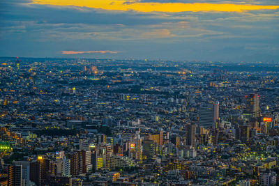 Aerial view of modern buildings in city against sky