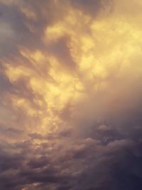 Low angle view of clouds in sky during sunset