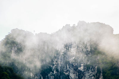 Scenic view of snow covered mountains against sky