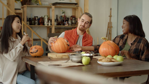 Portrait of woman preparing food at table