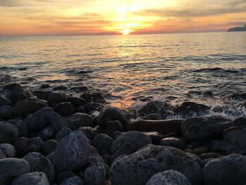 Scenic view of sea at sunset