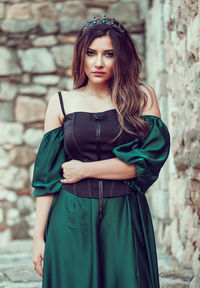 Portrait of beautiful young woman standing outdoors