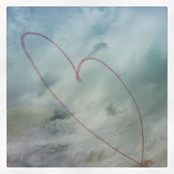 Low angle view of vapor trail against sky