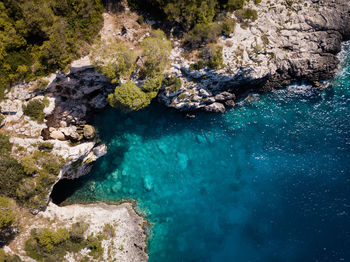 High angle view of rocks in sea