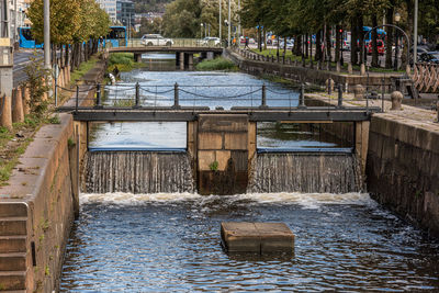 Old locks in the center of a city reglating water levels between canals
