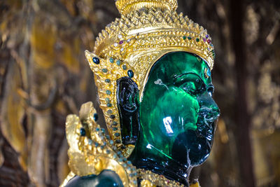 Close-up of buddha statue in temple