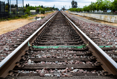 Railroad track amidst walkway