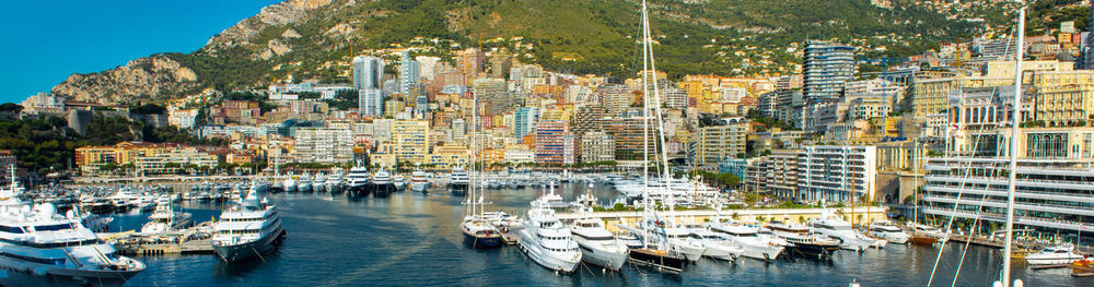 Boats moored at harbor