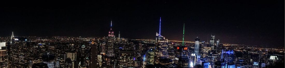 Illuminated city buildings at night