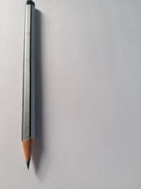 Directly above shot of pencils against white background