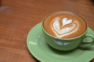 High angle view of cappuccino on table