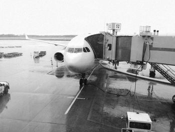 Airplane on runway against sky