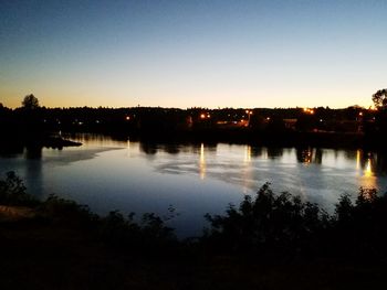 Scenic view of calm lake at sunset