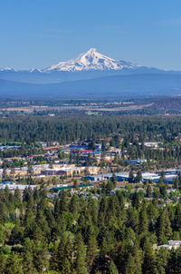 Scenic view of mt jefferson and town against sky