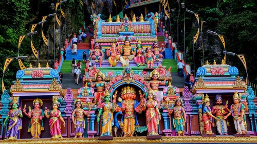 Statue of buddha against temple