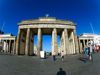 Low angle view of historical building against blue sky