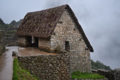 Old building against cloudy sky