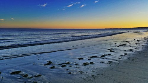 Scenic view of sea against sky at sunset