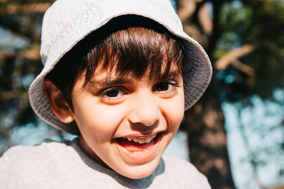 Close-up portrait of cute boy smiling 