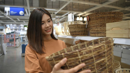 Young woman smiling in basket