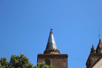 Low angle view of building against clear blue sky