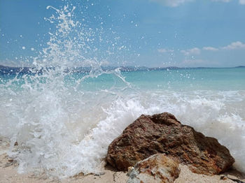 Sea waves splashing on rocks