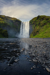 Low angle scenic view of skógafoss waterfall, southern iceland